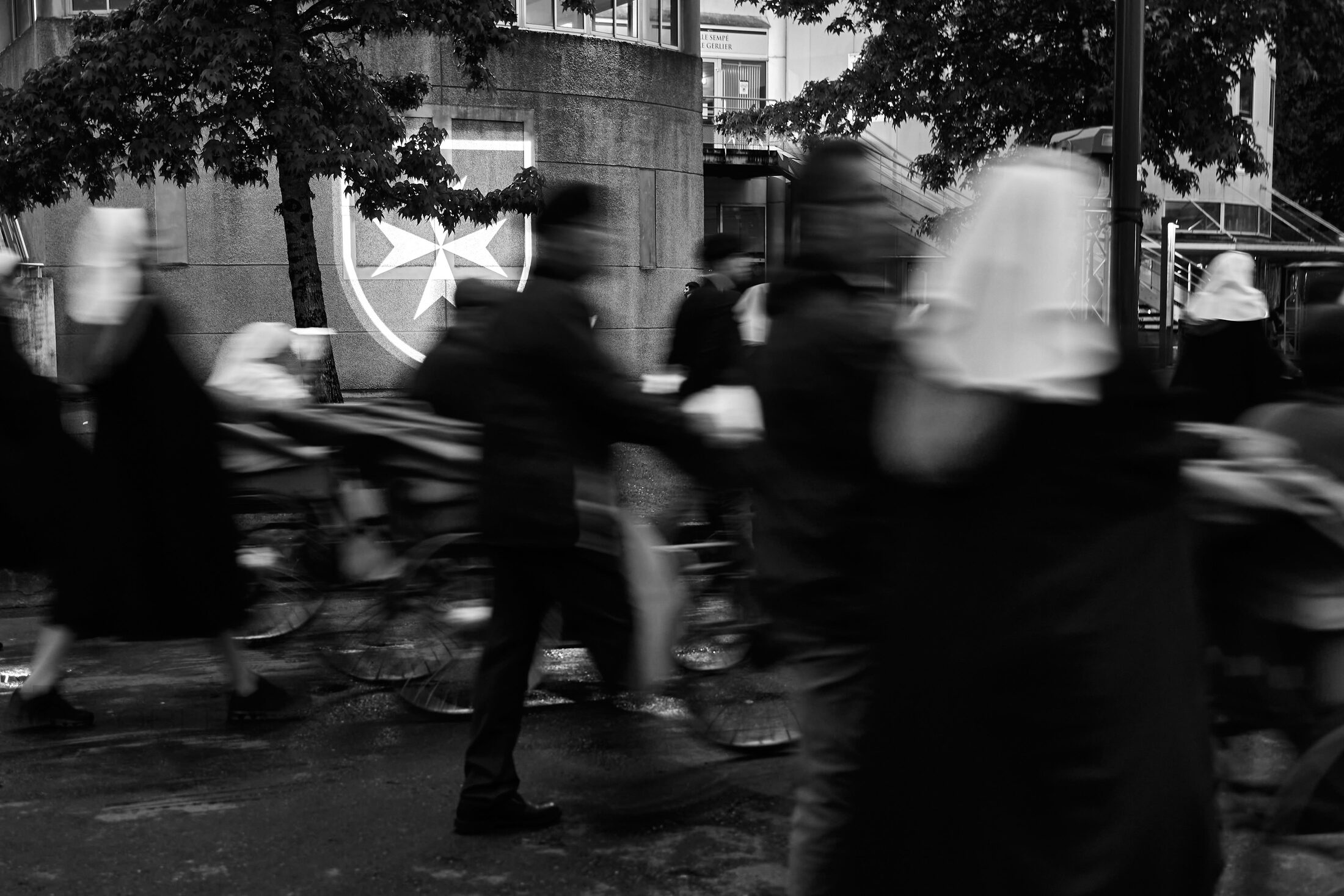 People move through a crowded religious procession at night.