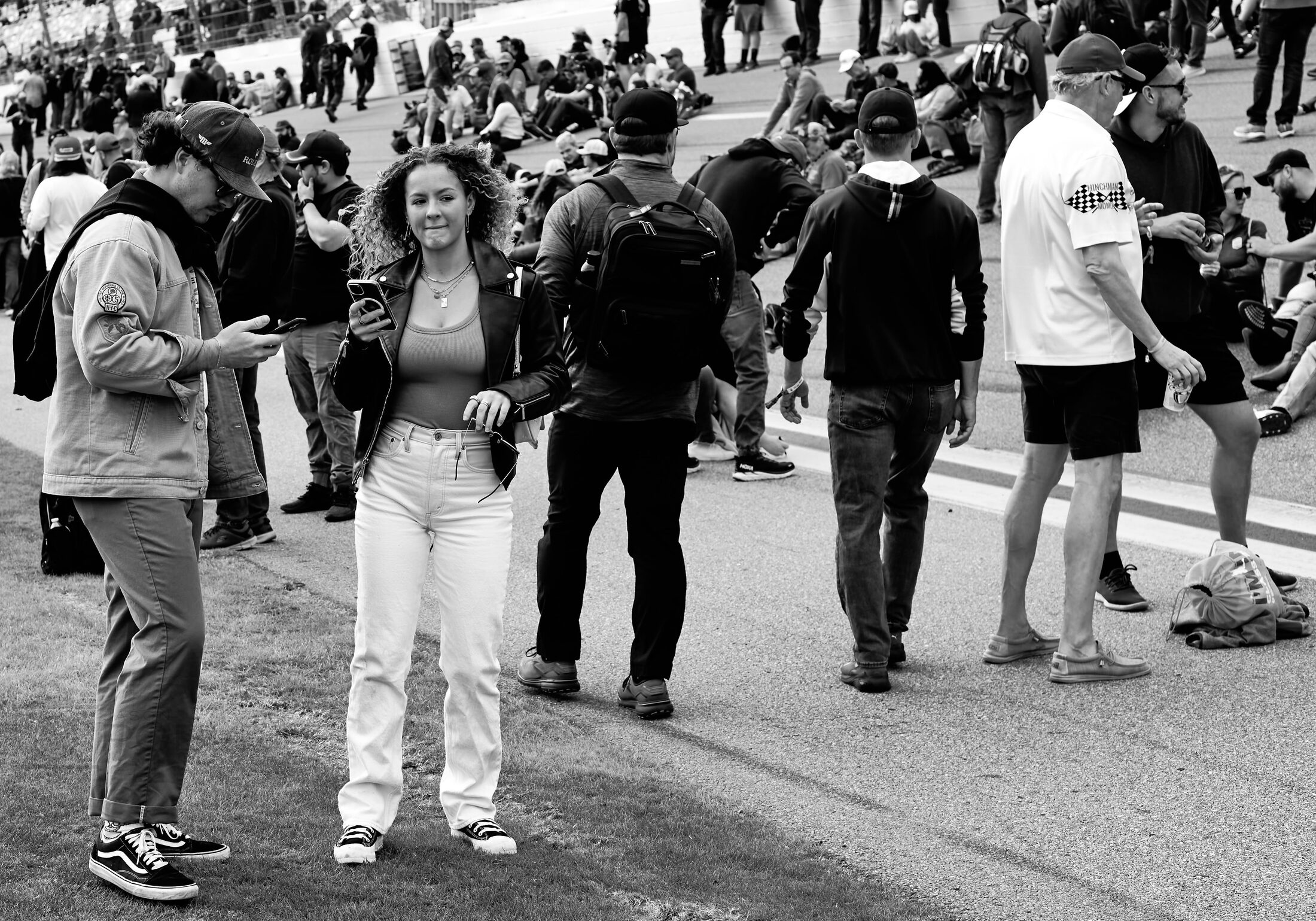 People walk together in a crowded street procession.