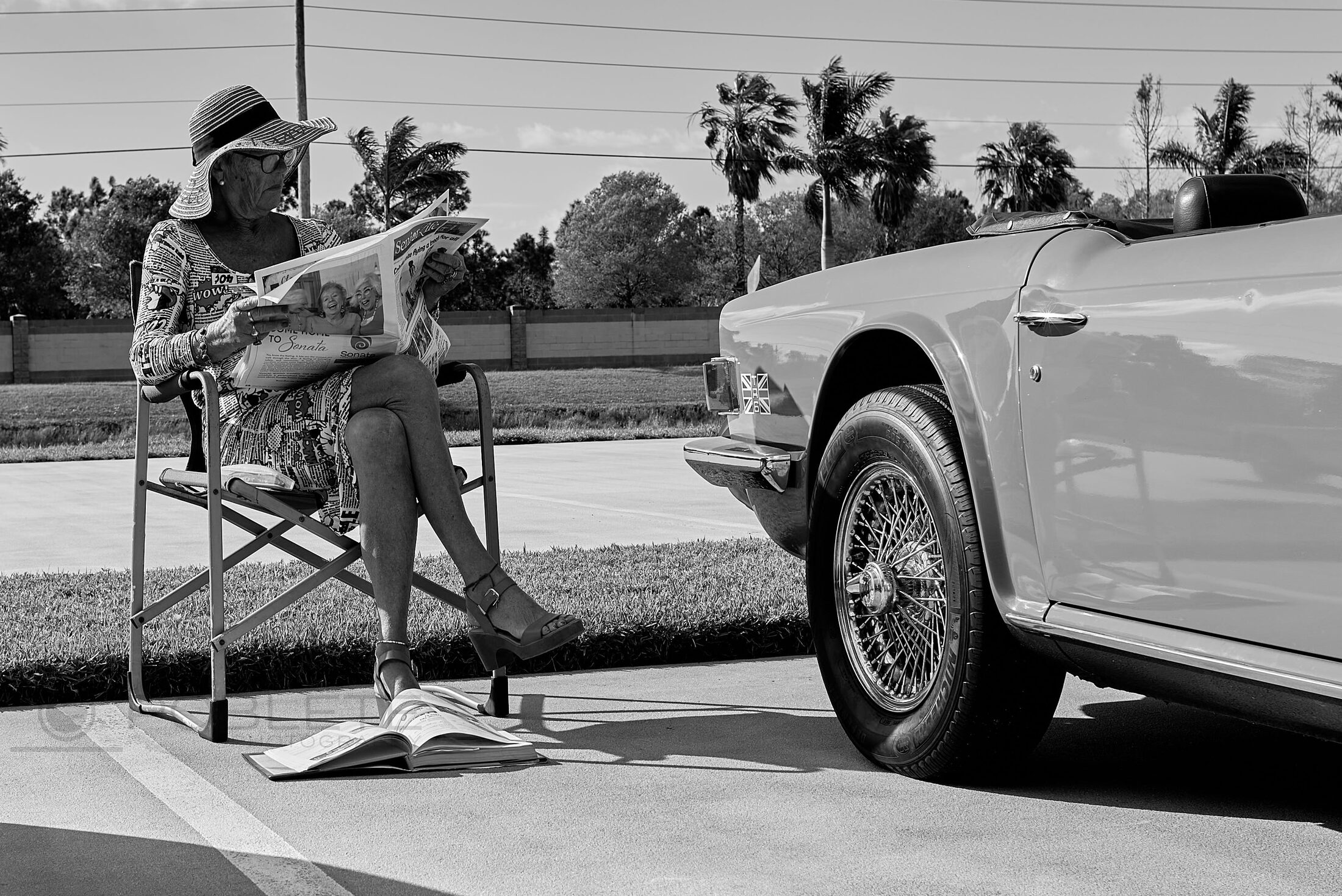 A person pushes a shopping cart beside a parked fire rescue truck.